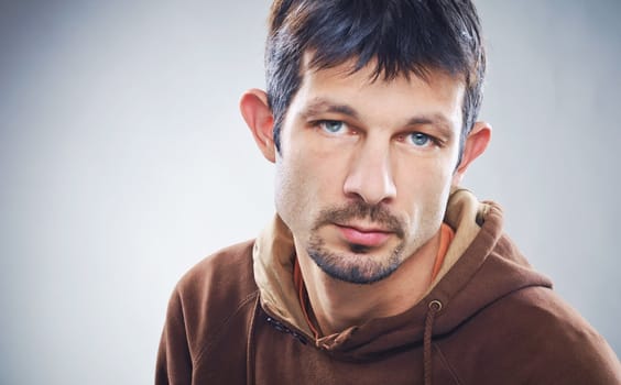 Casual young man portrait clouseup in the studio