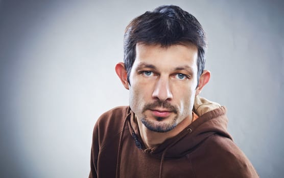 Casual young man portrait clouseup in the studio