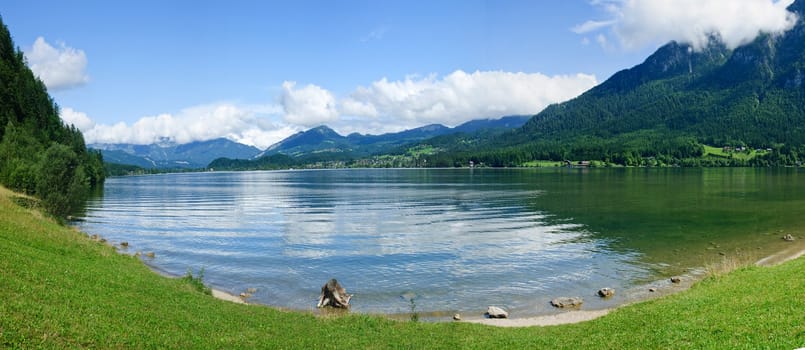 Panorama a blue transparent alpine lake. Salzkammergut. Austria