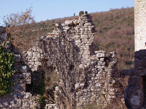 Ruins of a old abandoned stone house on a hill