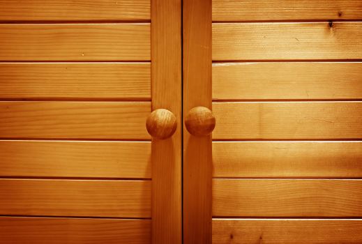 Old wooden wardrobe doors close up