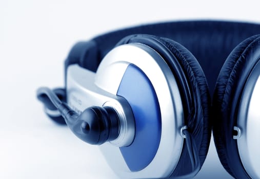 Headphones with microphone over white background