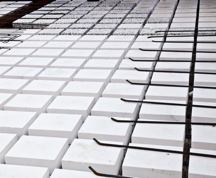 Technical detail of building operations: floor. Materials: polystyrene, steel bars, concrete
