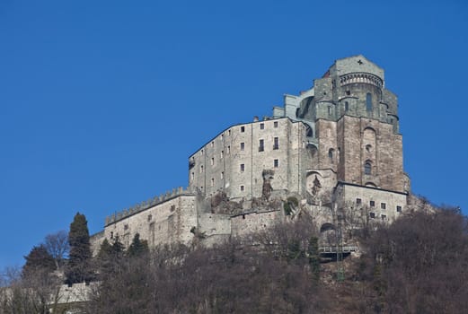 Abbey of 11st century, Piedmont region, Italy. The church, whose construction lasted for many years, is characterized by the unusual position and architecture.