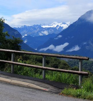 View on the snowy Alps from a road by summer, Switzerland