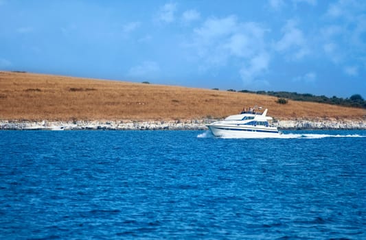 Motorboat speeding near the coast