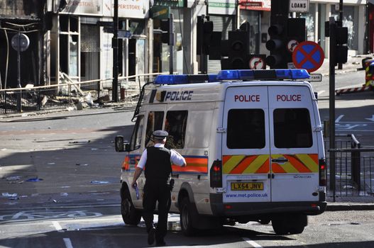 LONDON - AUGUST 09: Clapham Junction area is sacked after the third night of riots, on August 09, 2011 in London. Riots start spreading in London after Mark Duggan was shot dead by the police.