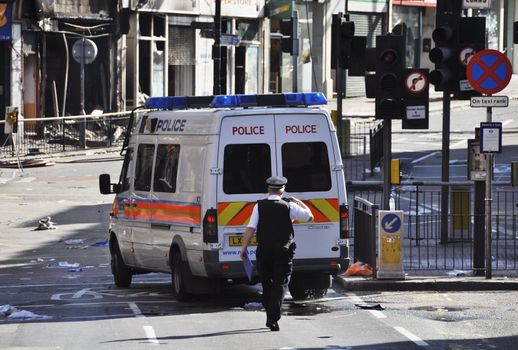 LONDON - AUGUST 09: Clapham Junction area is sacked after the third night of riots, on August 09, 2011 in London. Riots start spreading in London after Mark Duggan was shot dead by the police.