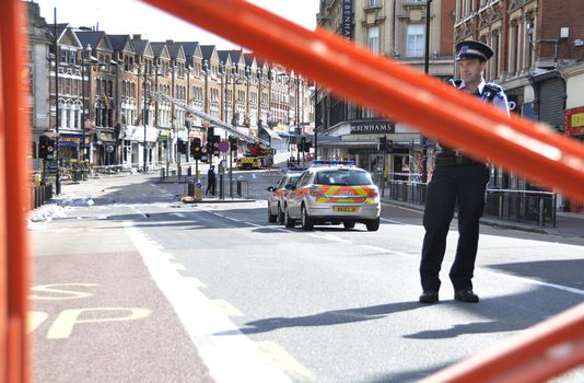 LONDON - AUGUST 09: Clapham Junction area is sacked after the third night of riots, on August 09, 2011 in London. Riots start spreading in London after Mark Duggan was shot dead by the police.