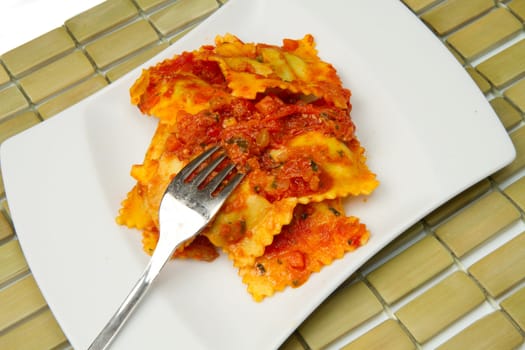 italian ravioli with red tomaotes sauce