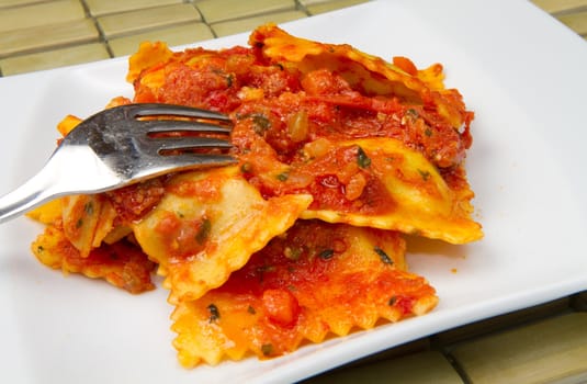 italian ravioli with red tomaotes sauce