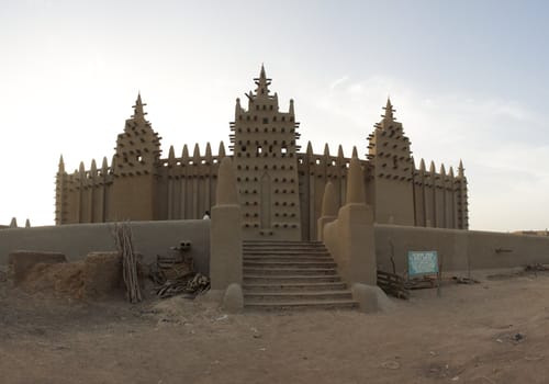 The big mosque in Djenné  and the traditional mud building in Mali. 