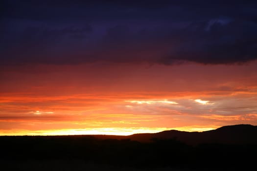 Sunset over the wide rural african landscape in Namibia, South West Africa.