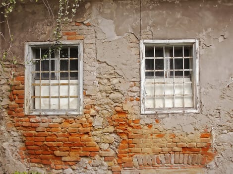 Two windows on a old grunge abandoned house