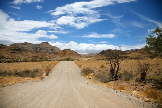 Gravel road in the region of Brandberg in Namibia