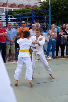 SOPOT, POLAND - JULY 16: The karate kids fighting for the competition on July 16, 2011 in Sopot, Poland
