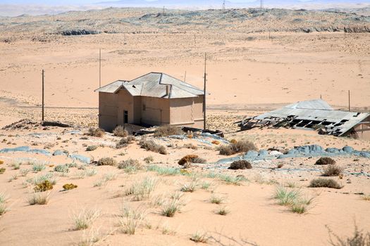Abandoned old house on a hill with intense blue sky - Luderitz in Namibia