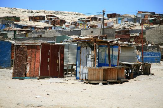Shacks in Luderitz Namibia against a blue sky