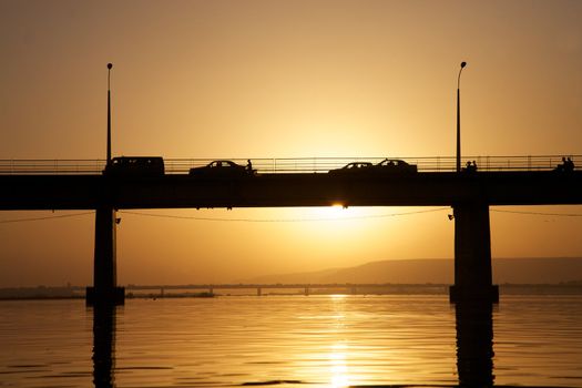 Pont des martyrs Bridge in Bamako - on the river the Niger with a beautiful sunset with people, cars, motorbikes