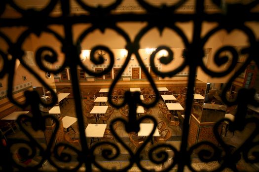 Empty tables in a restaurant on the Square Djamaa El Fna in Marrakesh at night