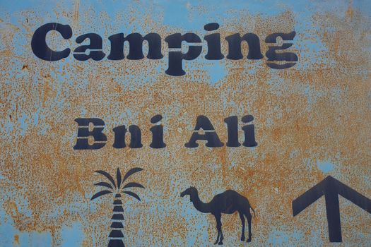 Fake camping signboard in the desert of Morocco