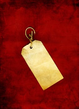 Old, blank paper tag on red background in grunge.