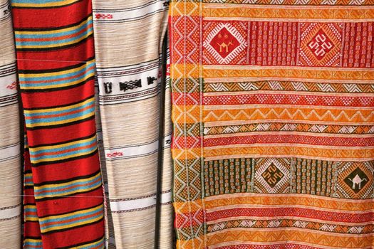 Selection of wonderfully bright colourful cloth at a market stall in Fez, Morocco