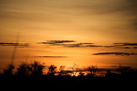 Moon rising late evening on the river of the Okavango