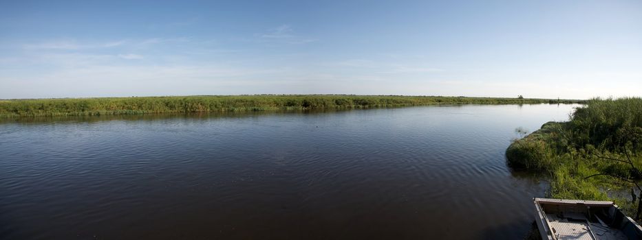 Landscape of water and grass in the Okavango Delta in North of Botswana. The Delta is the biggest sweatwater reservoir in this area and the water is absolutely clean