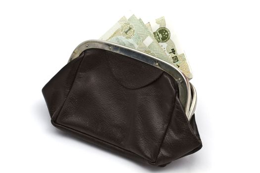 Chinese money in old purse isolated on white background 

