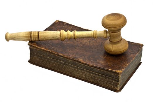 Old book and gavel isolated on white background