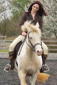 Girl riding horse