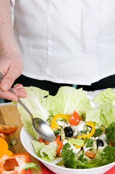 Preparation of salad from cheese and fresh vegetables