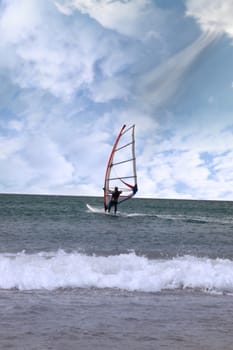 person windsurfing in the maharees in county kerry ireland during a storm with a gust of wind