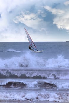 person windsurfing in the maharees in county kerry ireland during a storm