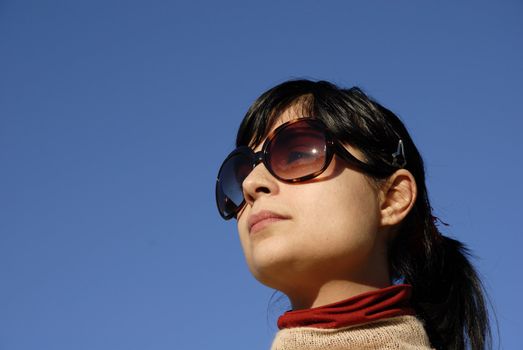 young casual girl portrait in the sun light