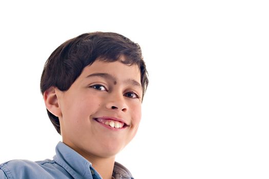 Close up of a latin boy with a cute expression, over white background with copy space.