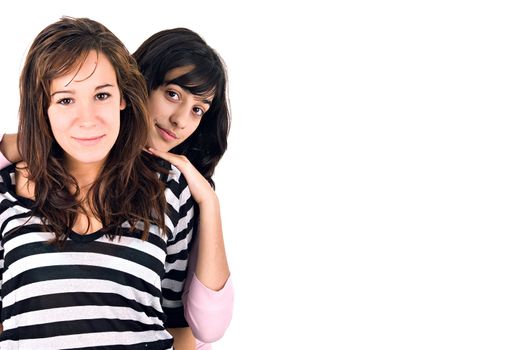 Two girls portrait with copy space, over white background.