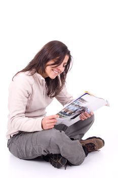 Young woman reading magazine.