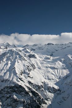 View over a snowy mountain in the Swiss Alps.