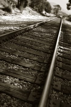 railroad tracks shown in a different perspective in black and white