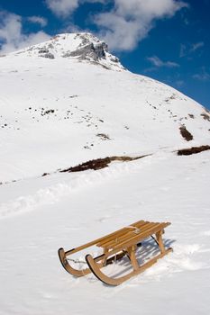 Photo of a sled on a mountain in the Swiss Alps.