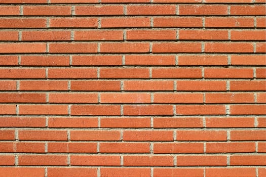 Red bricks wall with an ordinary pattern as a background