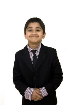 A handsome indian kid formally dressed in a suit