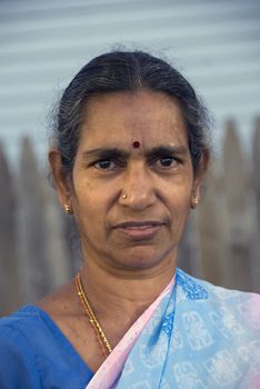 An old indian woman smiling in the summer sun