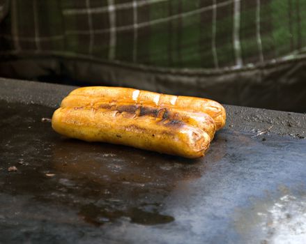 Hot dogs at an open grill in a local fair