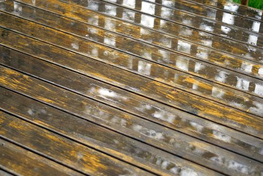 Abstract background of a wet wooden deck