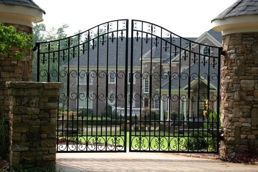 Brick mansion behind iron gate