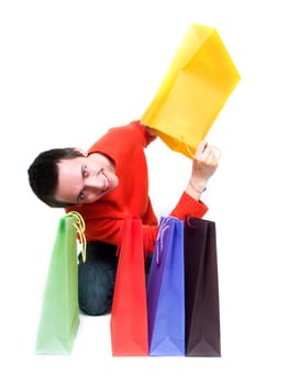 Young man holding shopping bags