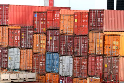 Stack of colorful freight containers on a dock